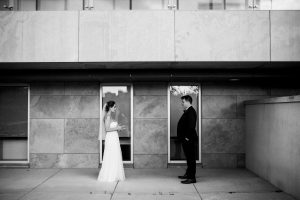 bride and groom standing across from each other