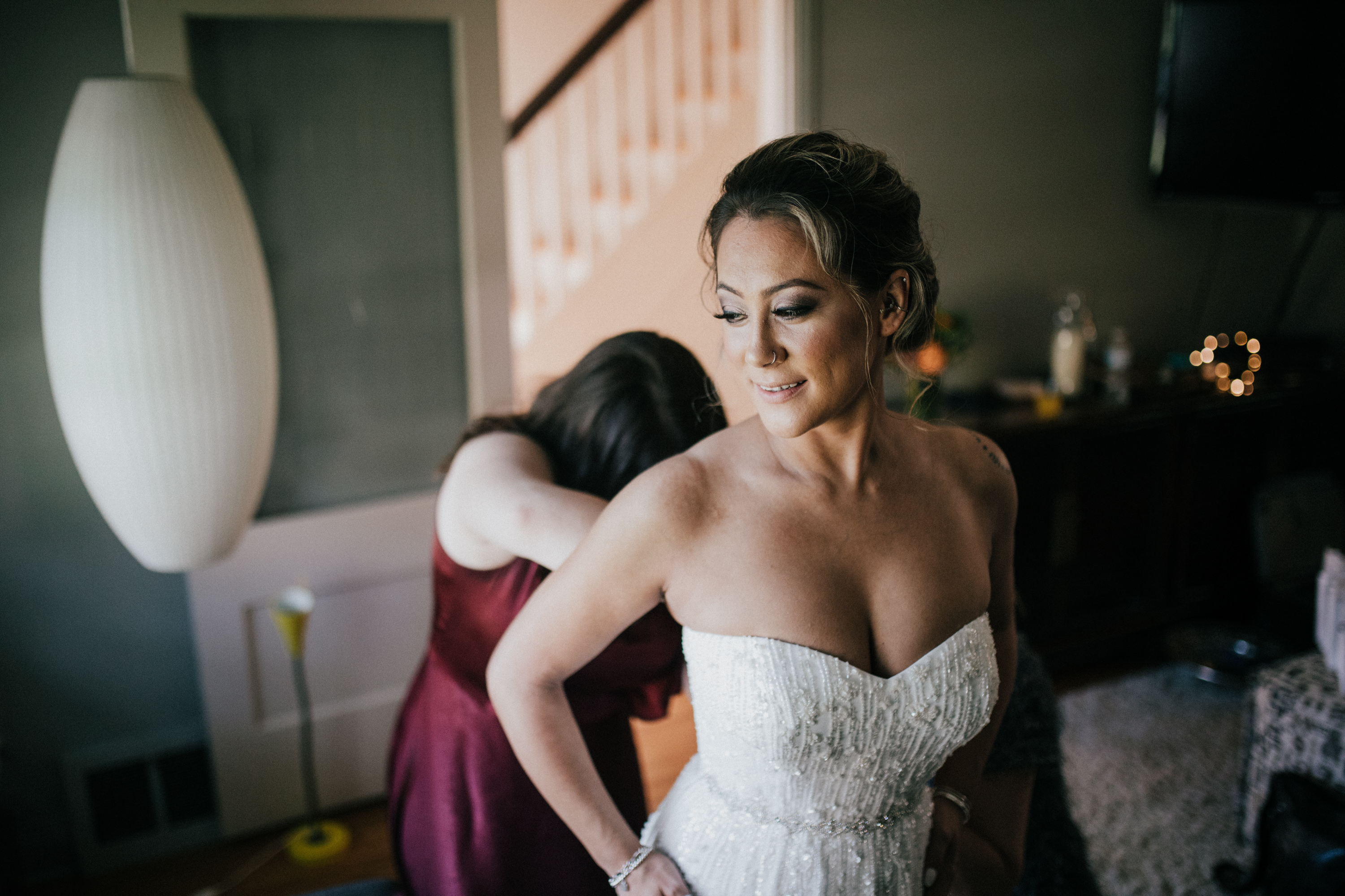 bride getting into dress