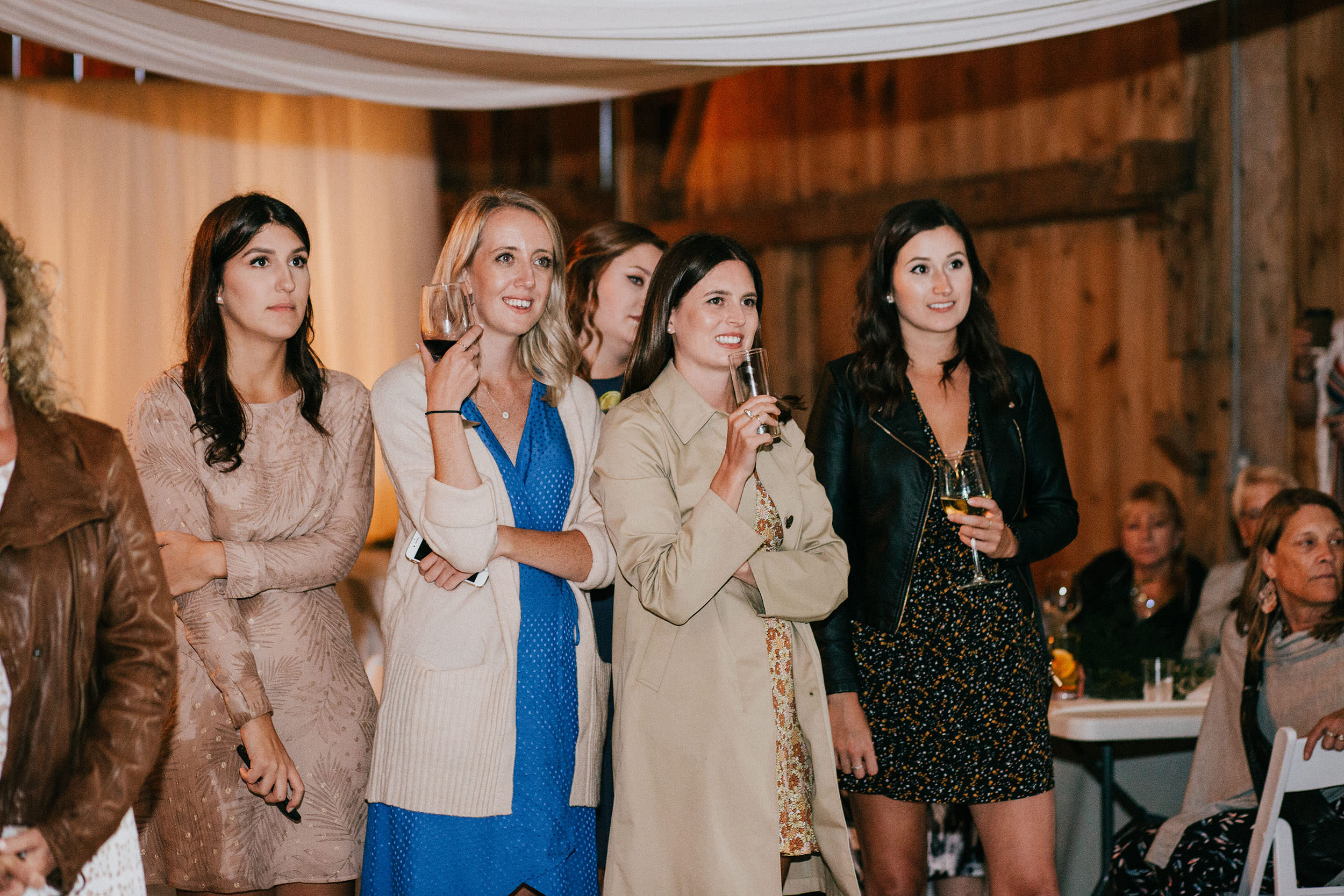 group of women smiling at wedding